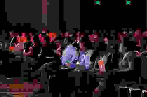 Audience members watch the RedisConf keynotes